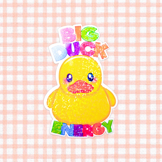 Bold holographic vinyl sticker featuring a yellow duck with the phrase 'Big Duck Energy' in colorful, energetic text, perfect for expressing a cheeky and confident vibe on any item.