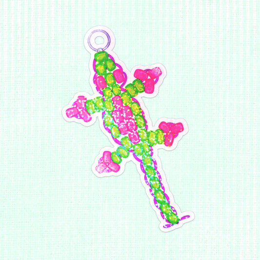 Colorful holographic vinyl sticker of a bead lizard, featuring bright pink and green beads in a playful design, perfect for adding a whimsical touch to any surface.