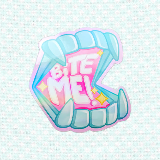 Holographic vinyl sticker featuring a stylized set of teeth with the phrase 'Bite Me!', set against a vibrant backdrop, ideal for adding an edgy touch to any item.