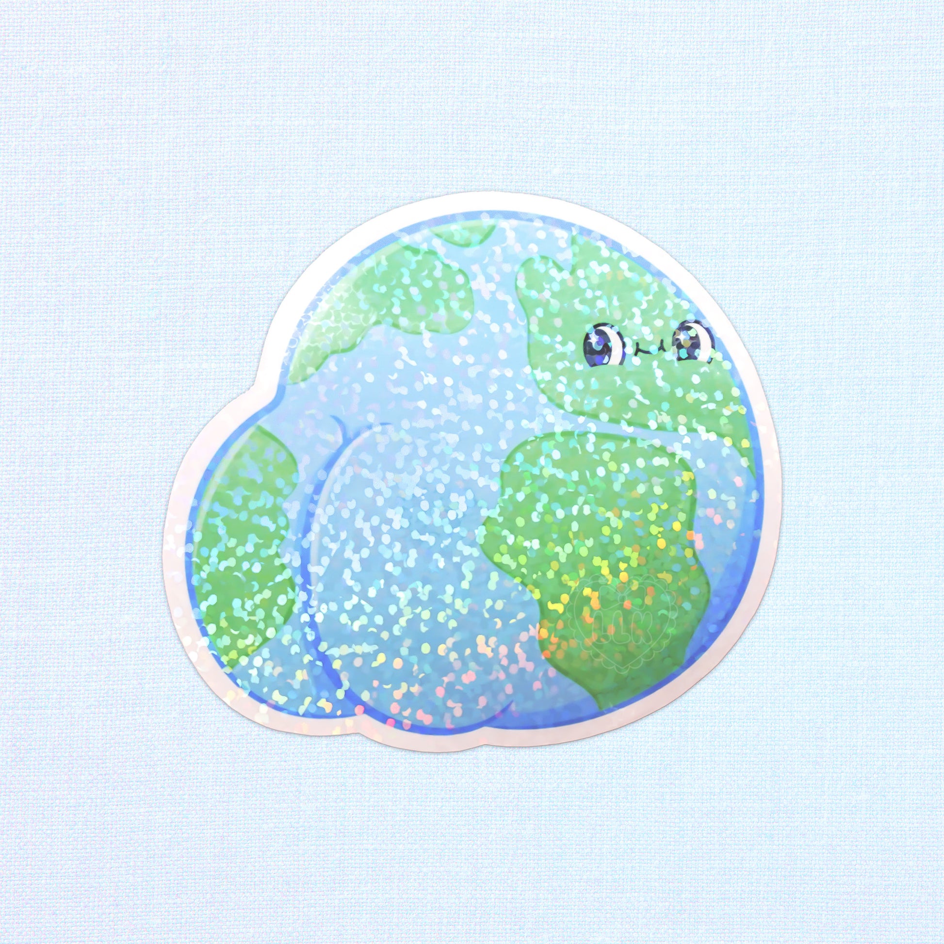 Colorful holographic sticker showing Earth with a playful, oversized butt, perfect for adding a humorous touch to your accessories.