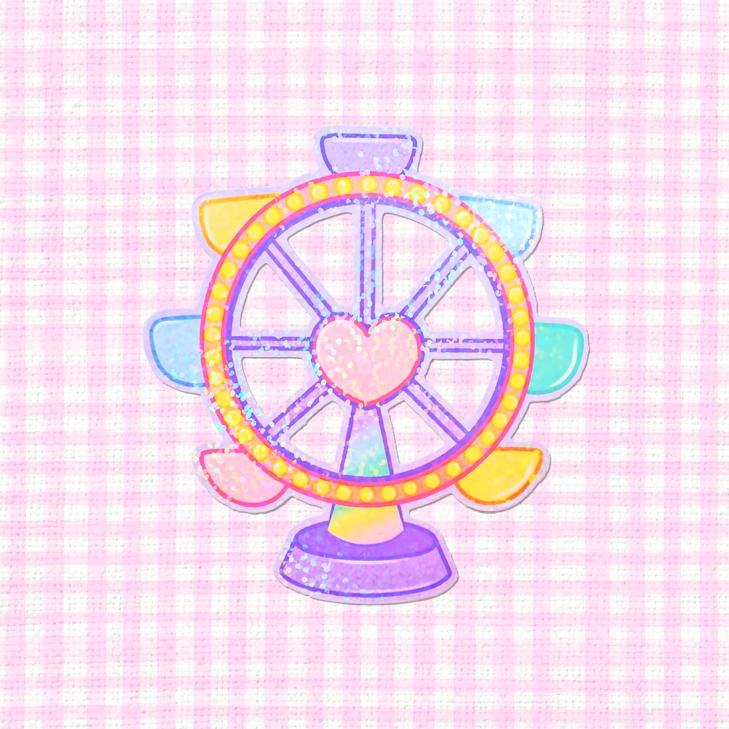 A holographic sticker of a pastel-colored ferris wheel with a heart in the center, featuring glittery accents.