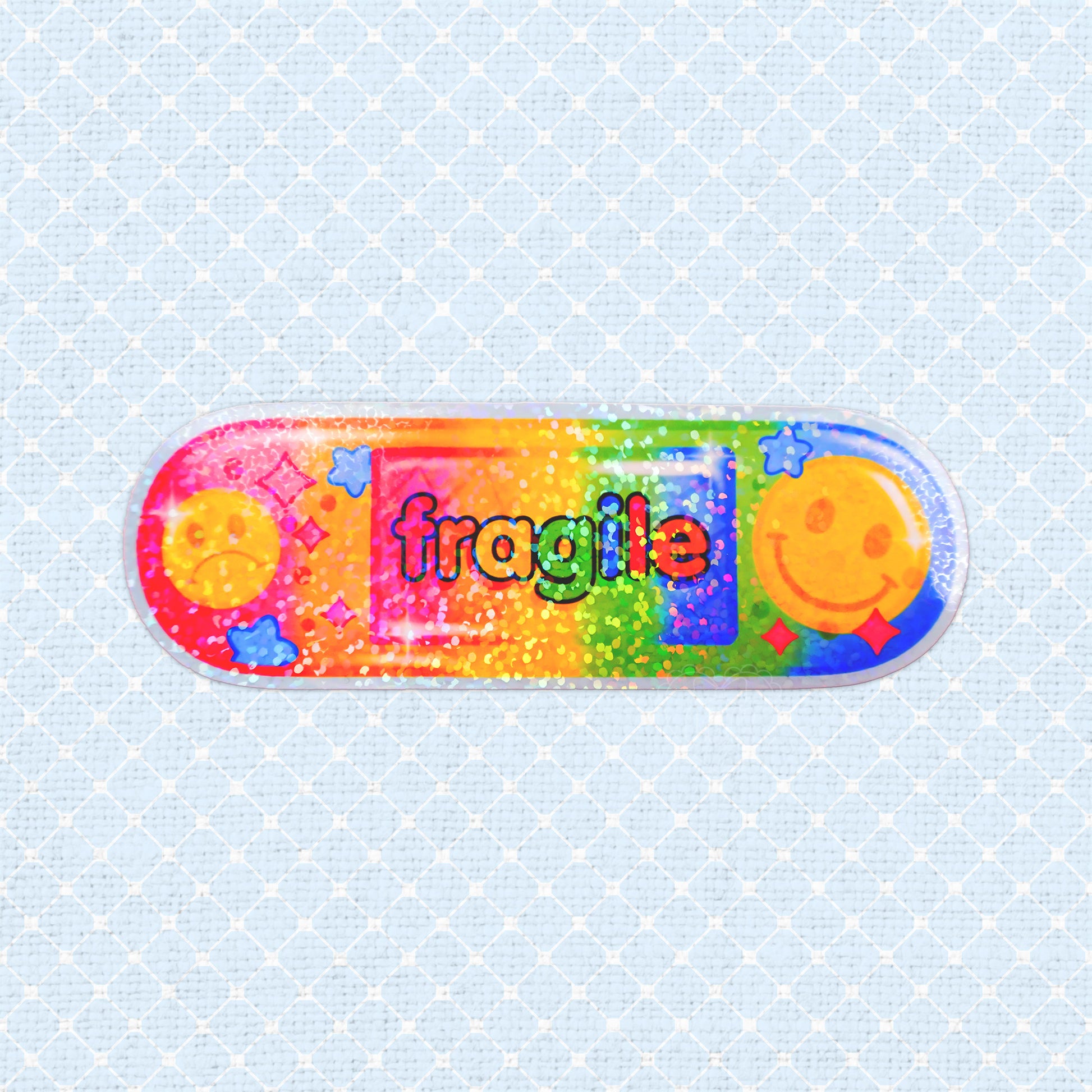 Rainbow holographic vinyl sticker with a colorful design saying fragile and happy faces.