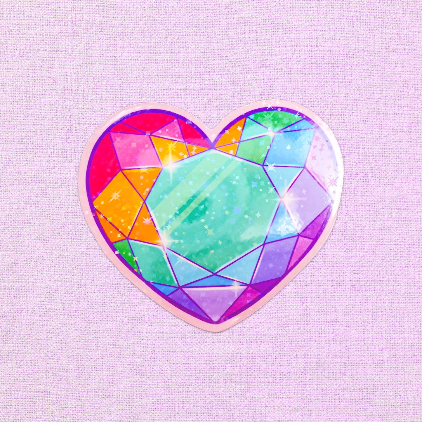 Colorful heart-shaped gem vinyl sticker with holographic shine.