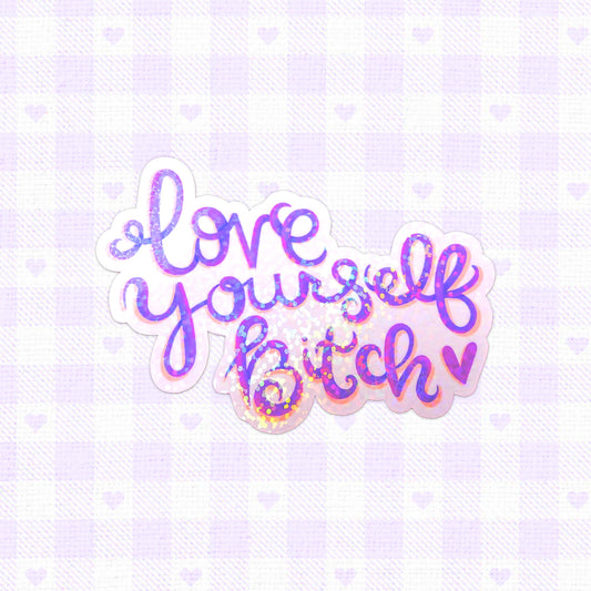 Holographic sticker with the phrase 'Love Yourself Bitch' in vibrant, glittery lettering.