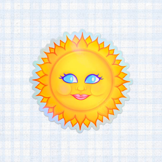 Smiling sun face in a holographic vinyl sticker.