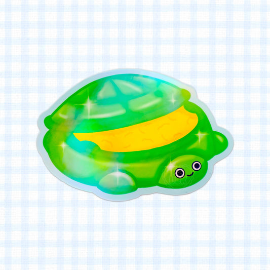 Holographic vinyl sticker of a cute turtle sandbox.